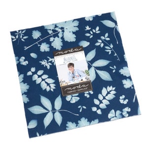 May include: A blue fabric square with a white leaf pattern. The fabric is part of the "Bluebell" collection by Janet Clare for Moda Fabrics.