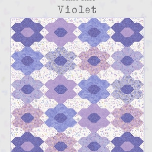 May include: A patchwork quilt in shades of purple and blue, with a floral design. The quilt has a white background with small floral details. The text "Janet Clare Violet" is at the top. Finished quilt dimensions are 196 x 208 cm.