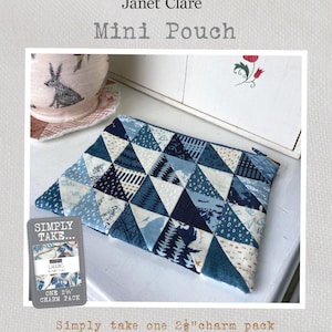 May include: A blue and white patchwork mini pouch with a zipper closure. The pouch measures 7 1/2 inches by 6 inches. The text "Simply Take..." and "Larking Janet Clare" is on a white label. The text "One 2 1/2 Charm Pack" is on the label. The text "Simply take one 2 1/2" charm pack to make this lovely mini pouch!" is below the pouch. The text "MINI POUCH MEASURES 7 1/2 X 6 INCHES" is below the text. The text "Janet Clare 2024" is at the bottom of the image.