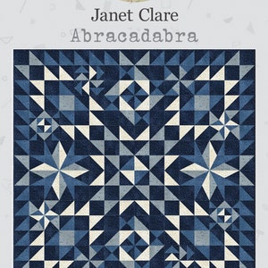 May include: A quilt pattern called "Abracadabra" by Janet Clare. The quilt is made of blue and white fabric and is 64 inches by 64 inches.
