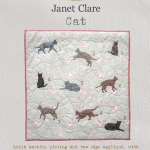 May include: A quilt pattern featuring nine different cat silhouettes in various poses, including sitting, lying, and standing. The quilt is made on a light green fabric with a floral pattern and a pink border. The finished quilt measures 40 x 42 inches.