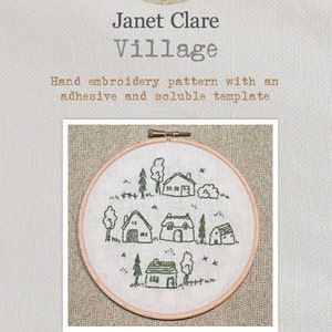 May include: A hand embroidery pattern for a village scene with houses, trees, and birds. The pattern is printed on a white fabric with a soluble adhesive backing. The finished embroidery measures 6 inches in diameter.