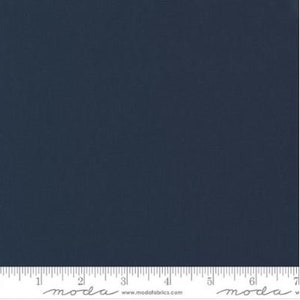 May include: A solid dark blue fabric swatch with a ruler and the text "moda" and "www.modafabrics.com" printed on it.