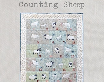 Counting Sheep - A delightful and fun appliqué quilt featuring rams, ewes and lambs frolicking in the meadow!