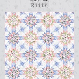 May include: A patchwork quilt with a floral design. The quilt features a repeating pattern of blue and white starbursts, each centered with a cluster of pink and white flowers. The finished quilt dimensions are 80 x 80 inches.