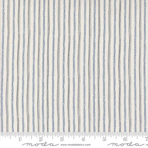 May include: Cream-coloured fabric with vertical stripes. Alternating lines of dark blue and light blue dotted and solid lines create a striped pattern. The fabric is measured in inches.