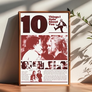 May include: A framed poster with a brown wooden frame. The poster features the text "10 Things I Hate About You" in a red and white colour scheme. The poster includes images of the movie's stars and quotes from the film.