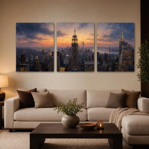 May include: A three-panel wall art set depicting a New York City skyline at sunset. The central panel features the Empire State Building illuminated against a vibrant orange and purple sky, while the side panels show surrounding skyscrapers.