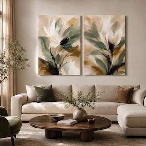 May include: A diptych wall art set featuring two rectangular canvases with abstract floral brushstrokes in shades of sage green, cream, white, and deep brown. The paintings display sweeping, fluid motions that create a layered, organic composition.
