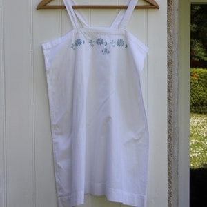 Old nightgown or embroidered cotton nightdress, white or blue tunic.