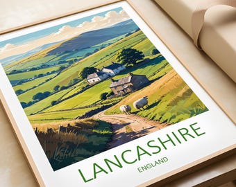 May include: A framed print of a landscape scene with rolling green hills, a winding dirt road, and two white sheep walking down the road. The print features the text "LANCASHIRE ENGLAND" in green letters at the bottom.