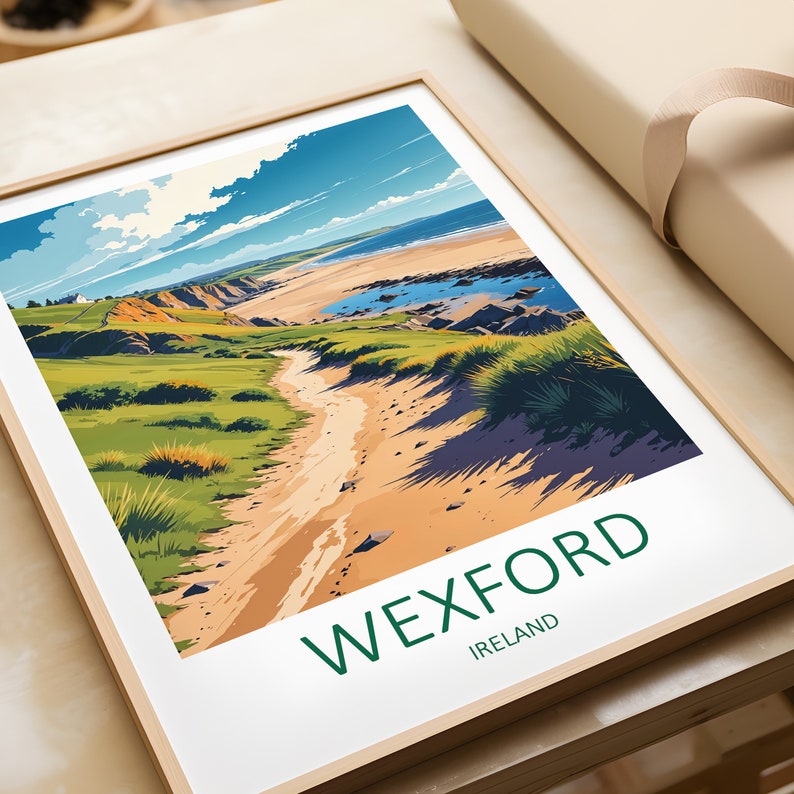 May include: A framed art print featuring a stylized landscape of Wexford, Ireland. The artwork depicts a sandy path leading to a beach, with green grass, blue water, and a bright sky. The word "WEXFORD" and "IRELAND" are printed in green.