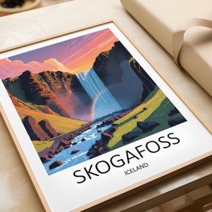 May include: A colorful illustration of Skogafoss waterfall in Iceland. The waterfall cascades down a cliff face with a rainbow in the mist. The text "SKOGAFOSS" and "ICELAND" is printed below the image.