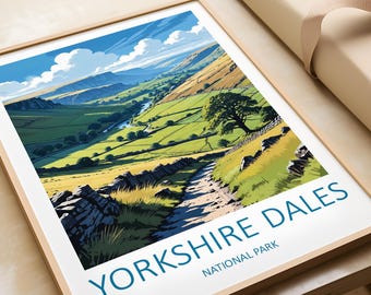 May include: A framed print of a scenic landscape with a winding road leading to a valley. The print features a blue sky with white clouds, green hills, and a river. The text "Yorkshire Dales National Park" is printed in blue at the bottom of the print.