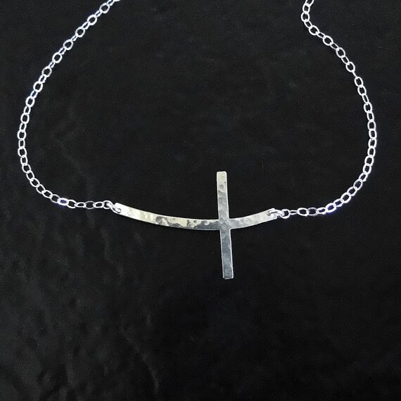 Sideways curved shop cross necklace