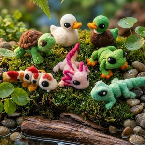 May include: A selection of handmade felt animal figurines, including a turtle, ducks, a frog, a lizard, an axolotl, and a koi fish. The creatures are set on moss with a water feature in the background.
