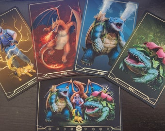 May include: Five illustrated cards featuring Pokemon characters. The cards are black with gold trim and feature the Pokemon characters against a colorful background. The characters include Pikachu, Charizard, Blastoise, Venusaur, and a group shot of all four.