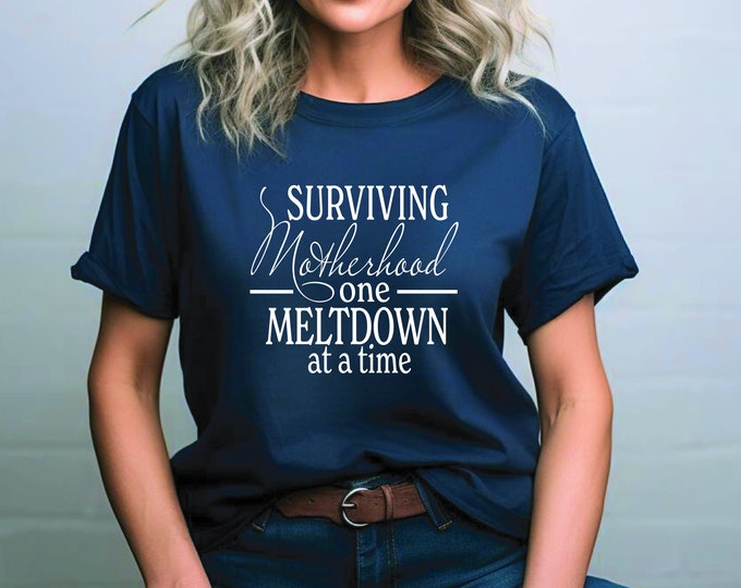 Mom Humor | Surviving Motherhood Shirt | One Meltdown at a Time | Mom Life Shirt | Toddler Mom | Mom Era | Sassy Gift for Moms