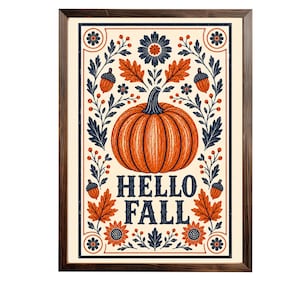 Könnte beinhalten: Ein gerahmter Kunstdruck mit Herbstthema. Das Kunstwerk zeigt einen orangefarbenen Kürbis in der Mitte, umgeben von Blättern, Blumen und Eicheln in Orange-, Marine- und Cremetönen. Die Worte "HELLO FALL" sind darunter zu sehen.