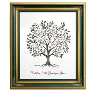 May include: A framed art print featuring a watercolor tree with leaves and small flowers in shades of gray and pink. The artwork is set against a white background and framed in a green and gold ornate frame. The text "Rooted in Faith, Growing in Grace" is at the bottom.