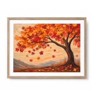 Peut inclure: Une peinture de paysage encadrée représentant un grand arbre aux feuilles d'érable rouge, orange et jaune éclatantes. Plusieurs feuilles tombent vers le sol, sur un fond de montagnes douces et brumeuses sous un ciel doré et chaleureux.