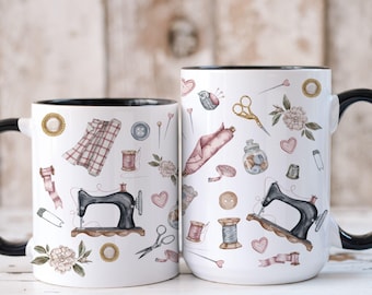 May include: Two white ceramic mugs with black handles and black rims. Both mugs feature a white background with a repeating pattern of sewing-themed illustrations, including sewing machines, spools of thread, buttons, scissors, and fabric.