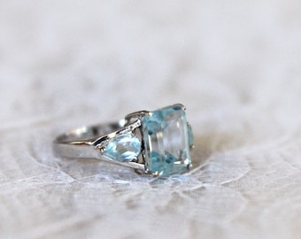 10K white gold ring, Emerald cut blue topaz ring, 3 stone solid white gold ring - rectangle and teardrop, Size 7.5