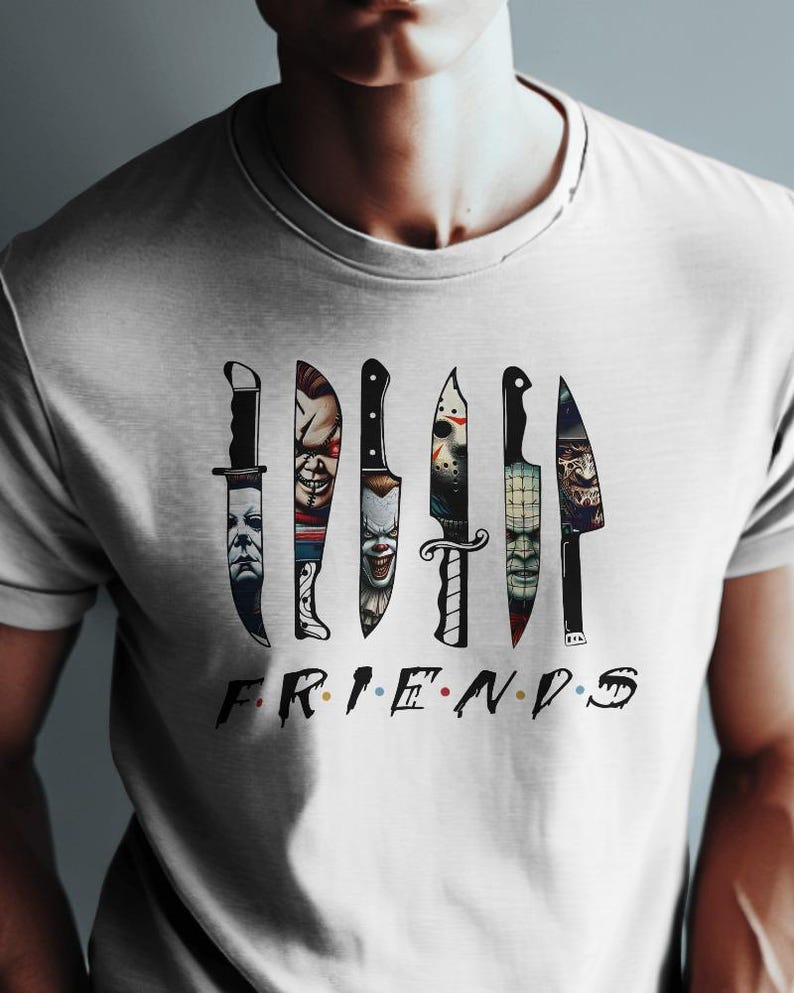 May include: White t-shirt with a graphic of knives with horror movie characters' faces on them. The text "FRIENDS" is below the knives.