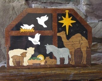 Rompecabezas de pesebre de madera tallado a mano con animales para la Natividad. Decoración navideña.