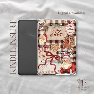May include: Kindle Insert with a festive Christmas design. The cover features a brown and white plaid pattern with holiday elements like Santa Claus, reindeer, and gingerbread. Text includes "Happy Holidays" and "Merry Christmas."