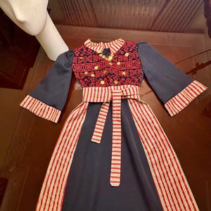 Costumized Palestinian Baby/ Girl Black Thobe and gold lira head band– Red Embroidery (1-12 y) abaya- مطرزات شرقيه -ثوب فلاحي -تطريز فلسطيني
