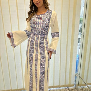 white dress shirt with blue buttons Embroidered White Flared Dress with Blue Accents main image 0