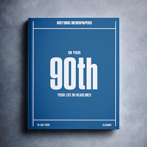 May include: A blue book with the title "On Your 90th Your Life In Headlines" and the date "16 July 1935" printed on the cover. The book is from the Historic Newspapers collection by Eleanore.