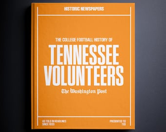 May include: An orange book titled "The College Football History of Tennessee Volunteers" from The Washington Post. The book cover features white text and the phrase "Historic Newspapers". The book is presented to Ted.