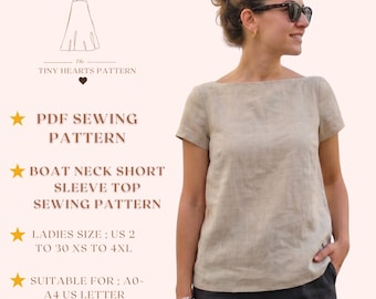 May include: A woman wearing a beige boat neck short sleeve top. The image includes text that reads "The Tiny Hearts Pattern", "PDF Sewing Pattern", "Boat Neck Short Sleeve Top Sewing Pattern", "Ladies Size: US 2 to 30 XS to 4XL", and "Suitable for; A0-A4 US Letter".