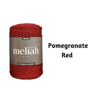 May include: A spool of 5mm red yarn labelled "meliah fios fio unique classique" with the text "Pomegranate Red" in the background.