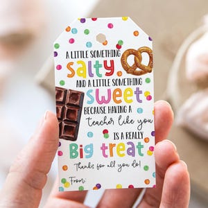 May include: A gift tag with colorful polka dots and text that reads "A LITTLE SOMETHING salty AND A LITTLE SOMETHING sweet." It includes images of a pretzel and a chocolate bar. The tag is for a teacher.