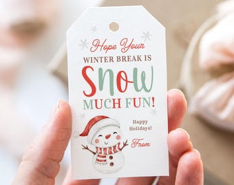 May include: A white gift tag with a snowman illustration and the text "Hope Your Winter Break Is Snow Much Fun!" in red and green. The tag also includes "Happy Holidays!" and a "From" section.