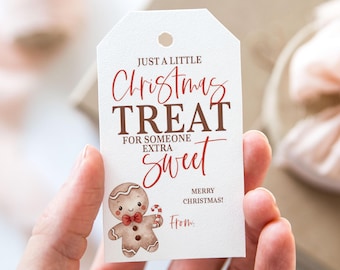 May include: A white gift tag with red and brown text that reads "Just a little Christmas Treat for someone extra sweet. Merry Christmas! From..."  A gingerbread man illustration is in the bottom left corner.