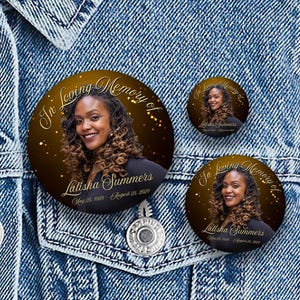 May include: Three round memorial buttons with a photo of a woman, the text "In Loving Memory of Latisha Summers" and dates. The buttons are set against a denim jacket.