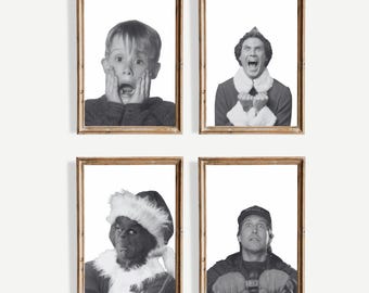 May include: Four framed black and white prints featuring iconic movie characters. The prints include a surprised child, a man in an elf costume, the Grinch, and a man with a shocked expression. The frames are a warm brown color.
