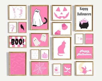 May include: A collection of framed Halloween-themed art prints. The prints feature pink backgrounds with various white and black illustrations, including ghosts, cats, bats, and the text "BOO!" and "Happy Halloween."
