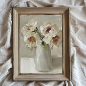 May include: A framed painting depicting a bouquet of white flowers arranged in a white vase. The flowers are presented in a loose, natural style, and the painting is executed in a realistic manner.