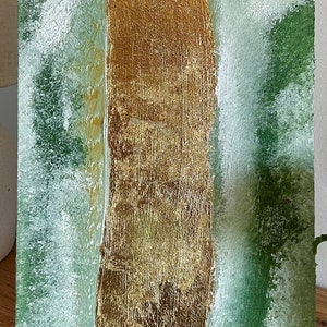 Abstract acrylic painting with textured green and gold leaf on canvas, creating a natural, organic feel.