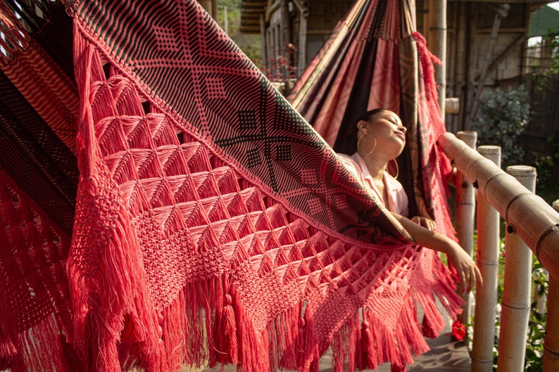 Colombian Luxury hammock for indoor and outdoor use and decor. Pink and black handmade hammock featuring intricate macrame/crochet fringes, perfect for adding a pop of color and artisanal charm to any space.