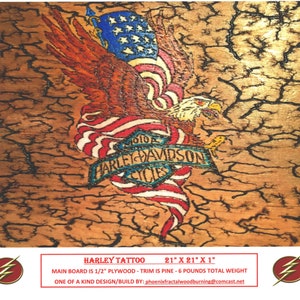 May include: A wood-burned artwork featuring an American bald eagle holding an American flag with the Harley Davidson logo in the center. The artwork is 21 inches by 21 inches and 1 inch thick. The main board is 1/2 inch plywood and the trim is pine. The artwork weighs 6 pounds.