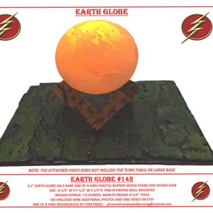 May include: A 3.1 inch Earth globe on a wooden stand with a fractal burned design. The stand is made of pine plywood and measures 6.5 inches wide by 7.5 inches long. The globe is mounted on a wall and weighs approximately 7 ounces. The stand is 1/4 inch thick.