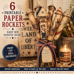 May include: A collection of six printable paper rockets with patriotic designs, including images of a puppy, a sailor, and a cat. The rockets are displayed in a glass jar tied with a red, white, and blue ribbon. The image includes text that reads "Printable Paper Rockets" and "Easy DIY Patriotic Decor!"