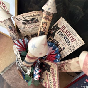 Printable paper rocket templates with patriotic graphics for summer parties barbecues and Americana displays
