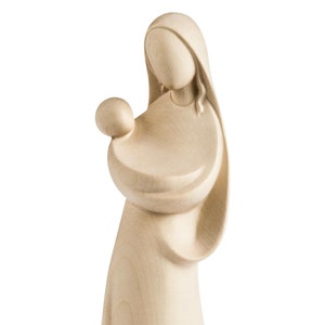 madonna with jesus modern style, wooden sculpture from Val Gardena. The statue is carved in maple wood